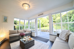 The sun lounge leads out to the secluded rear garden